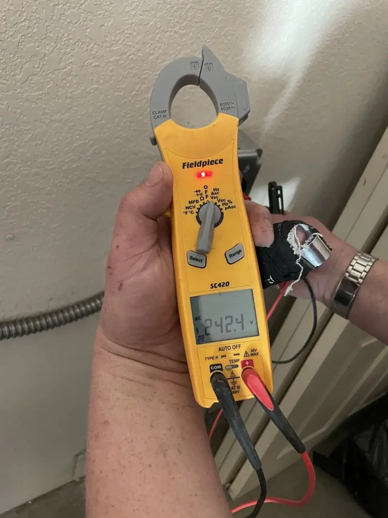 Voltage testing with clamp meter during Ceiling Fan Installation in Closter